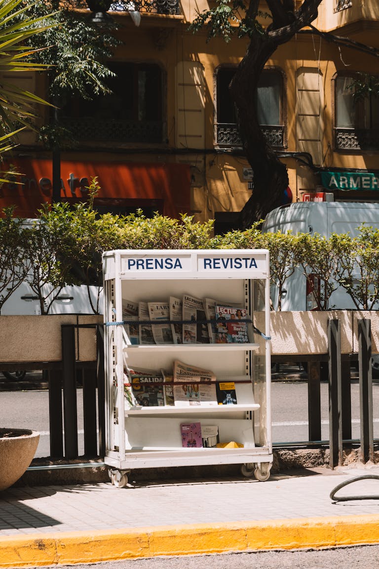 Shelves with Newspapers at Sidewalk